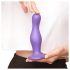 Strap-on-me Curvy L - aaltoileva, imukupilla varustettu dildo (violetti)